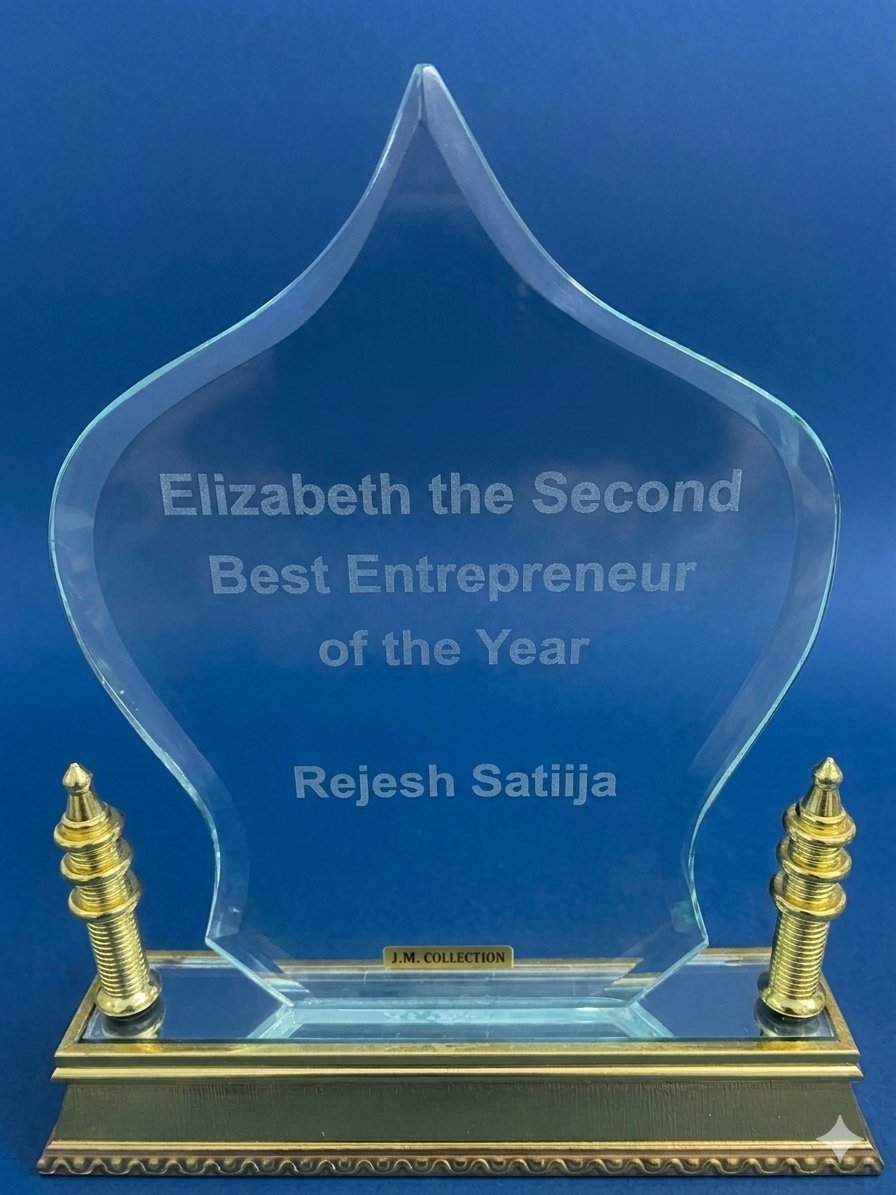 Elizabeth the Second Best Entrepreneur of the Year glass award for Rejesh Satiija