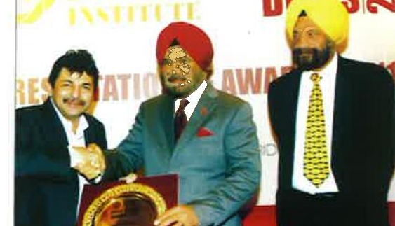 Receiving award, present H.E. Gen. J.J. Singh and Tarlochan Singh MP